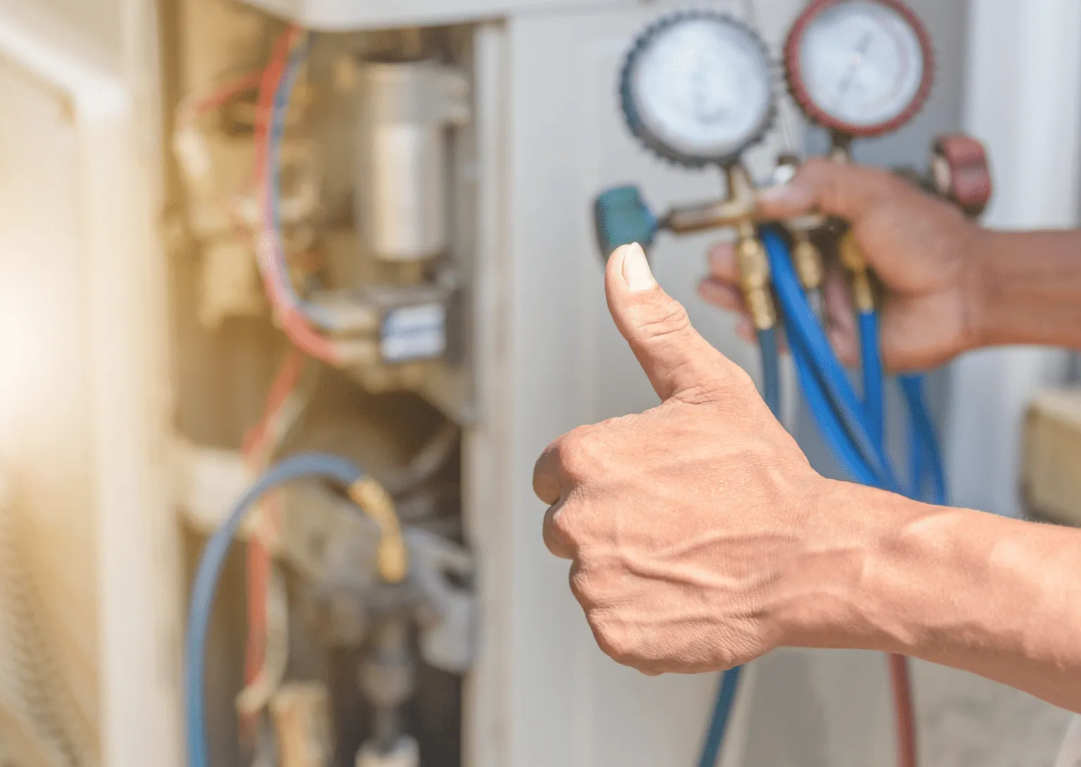 Successful HVAC system test with gauges connected and thumbs-up approval