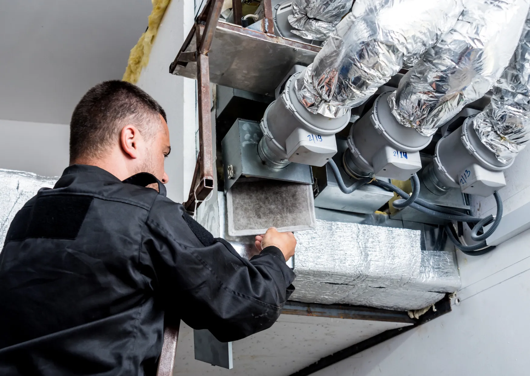 Dirty ventilation filter being replaced to restore efficient air circulation and healthier home air quality